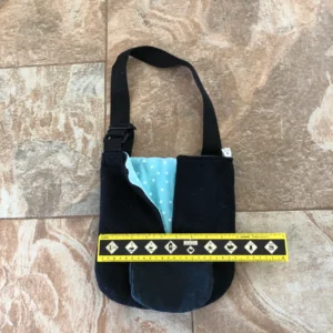 A black bag with blue and yellow accents on the side.