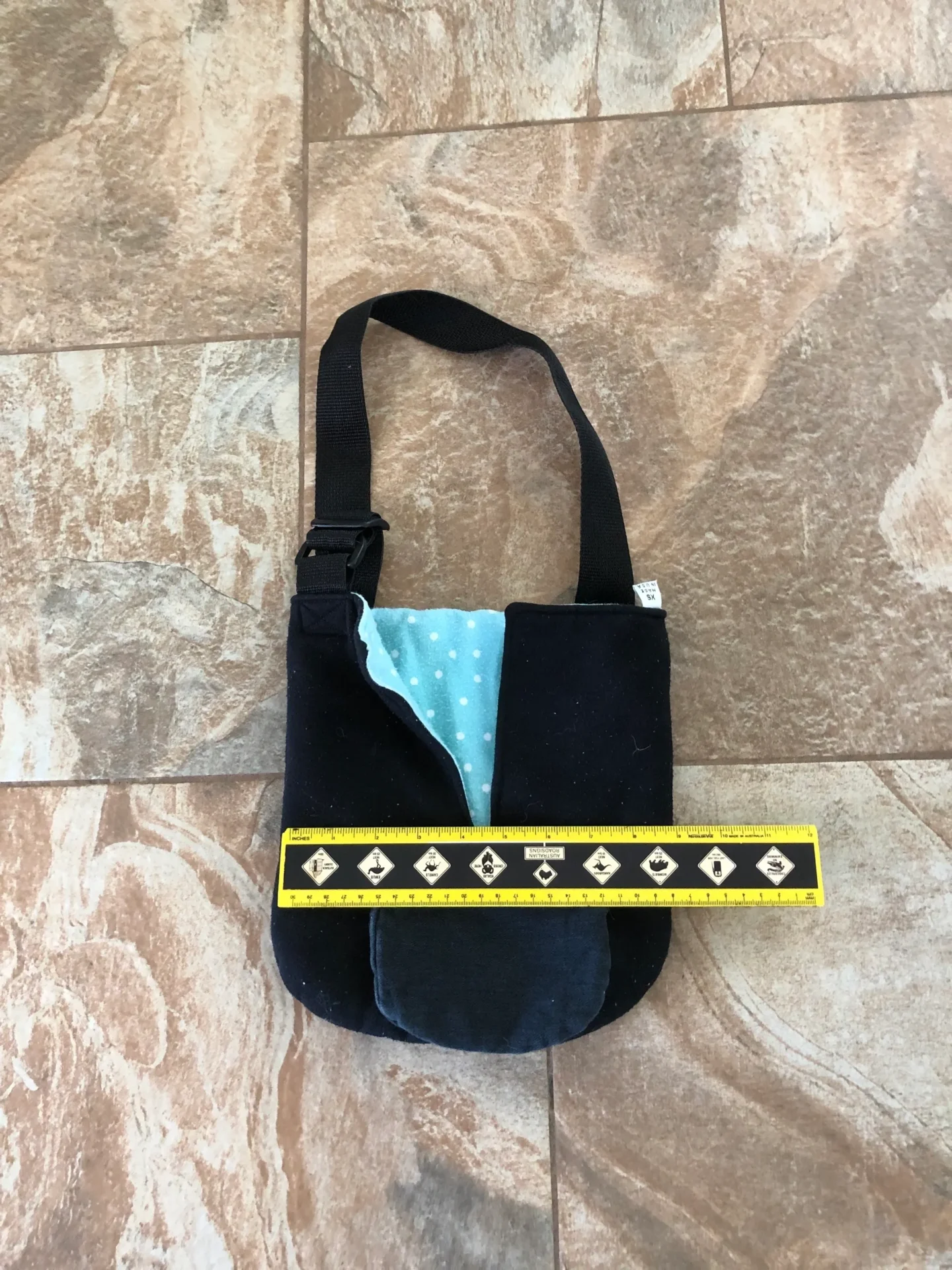 A black bag with blue and yellow accents on the side.